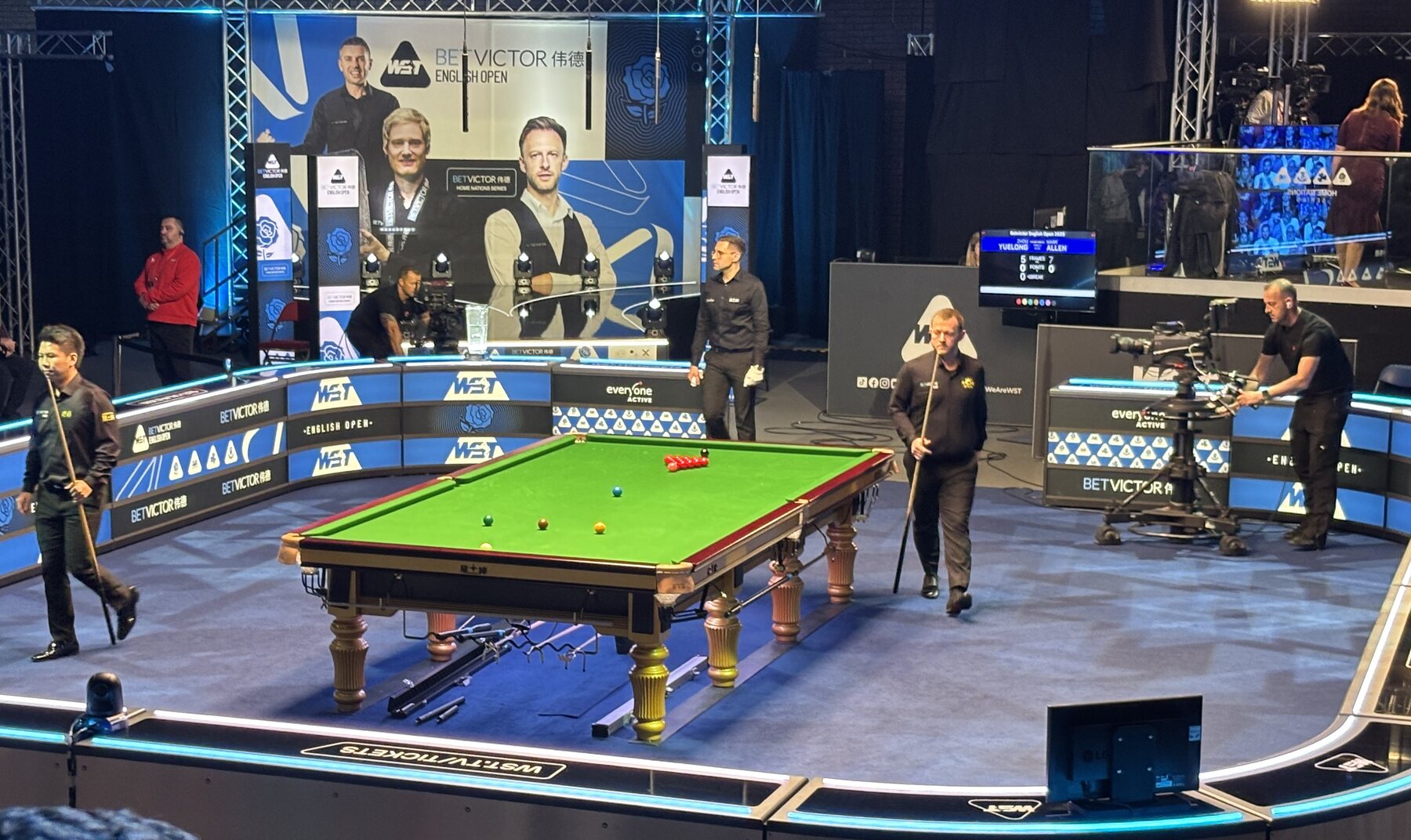 Players, officials and television cameras around the table before the 2025 English Open final.